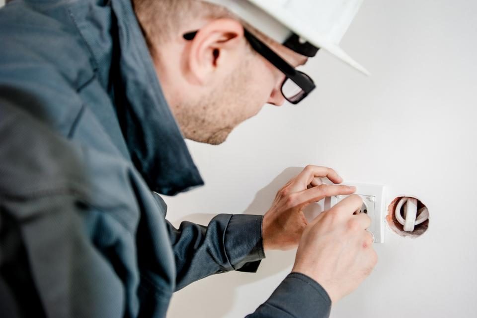 Electrician fitting a socket