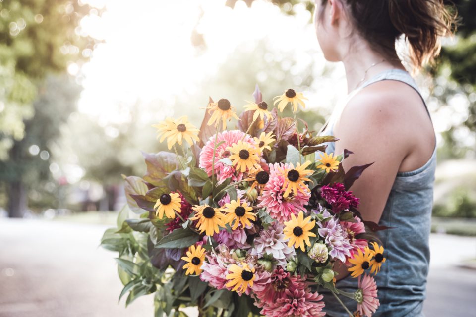 Florist carrying a bouquet of flowers