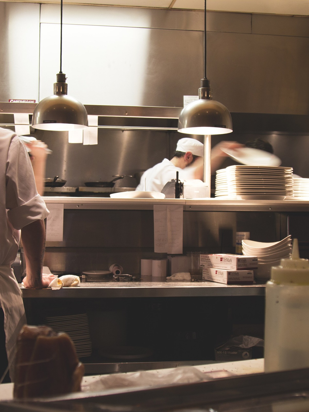Chefs working in a busy independent restaurant kitchen